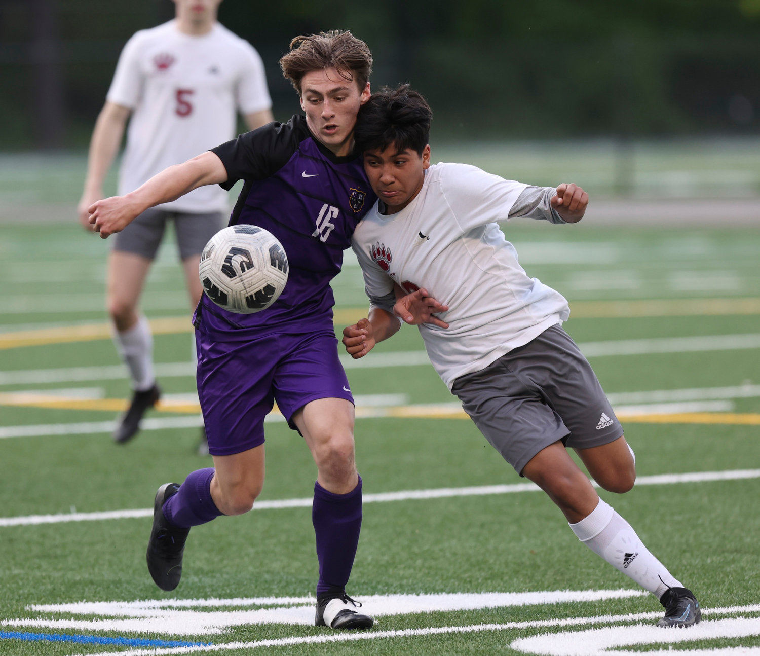 Columbia River's Elliot McClafferty, left, and W.F. West's Adrian Jaimes, right, battle for the ball in the first round of the 2A state playoffs Tuesday in Vancouver.